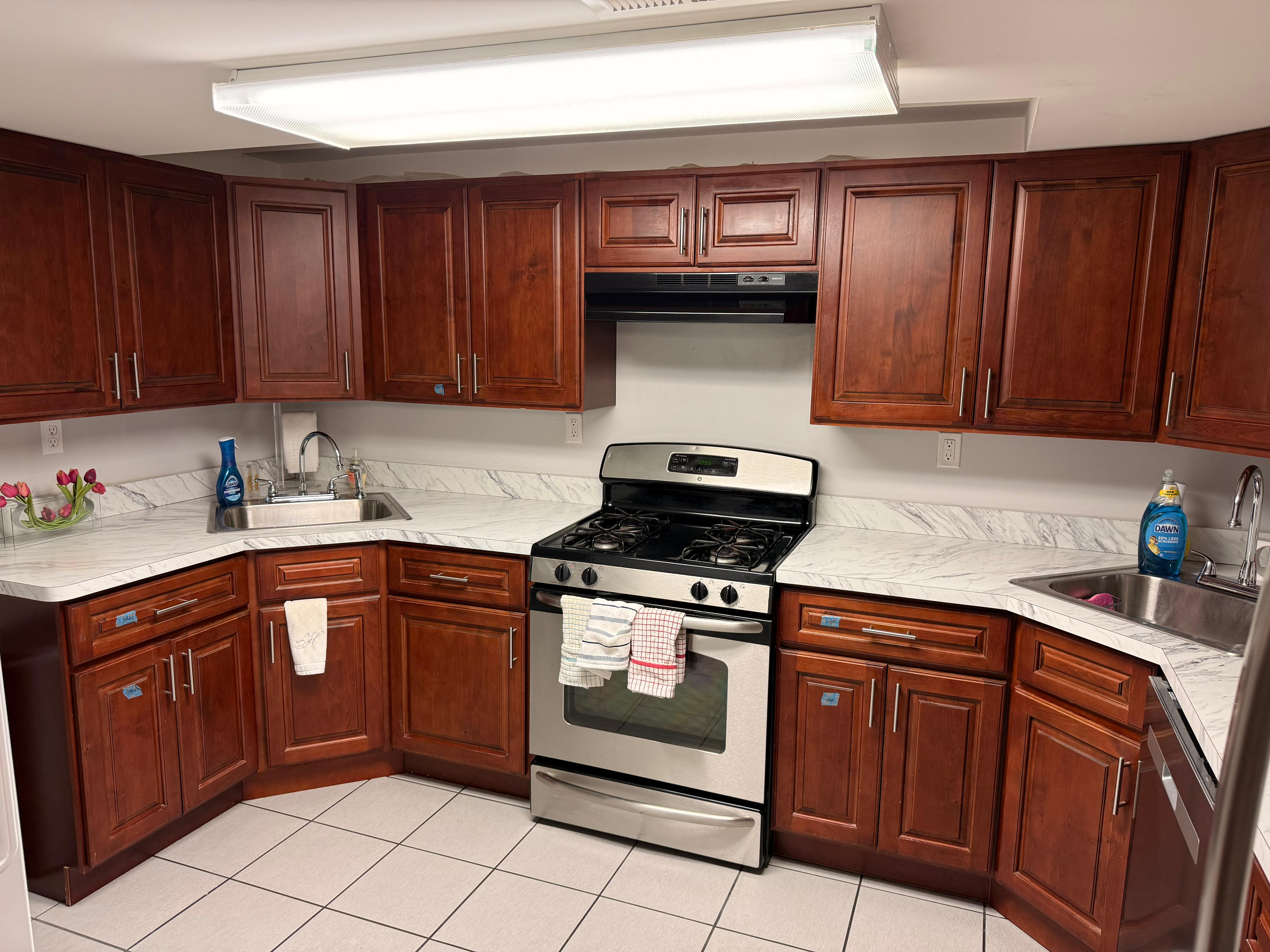 Professional kitchen cleaning - cherry wood cabinets